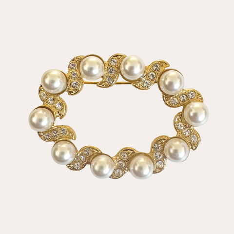 Gouden broche met pareltjes